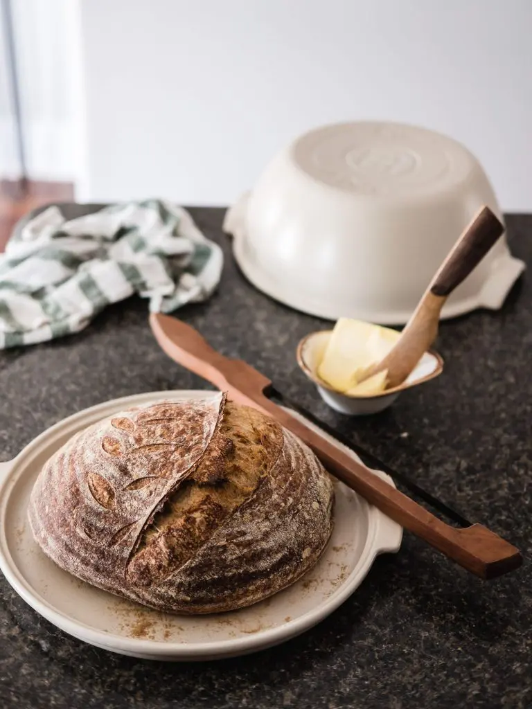 Beautifully baked bread in the Emile Henry linen coloured round bread baker.